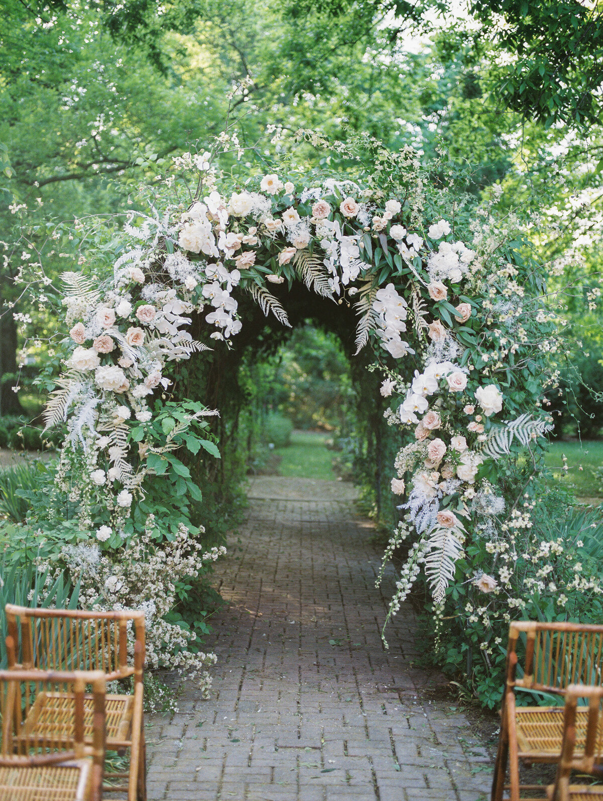 A beautiful lush, floral arbor by Chattanooga wedding photographer, Kelsey Dawn Photography