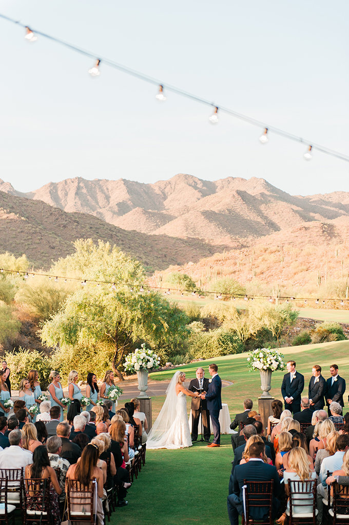 A beautiful wedding ceremony at the Silverleaf Club in Scottsdale, AZ, featuring breathtaking desert views and elegant floral arrangements.