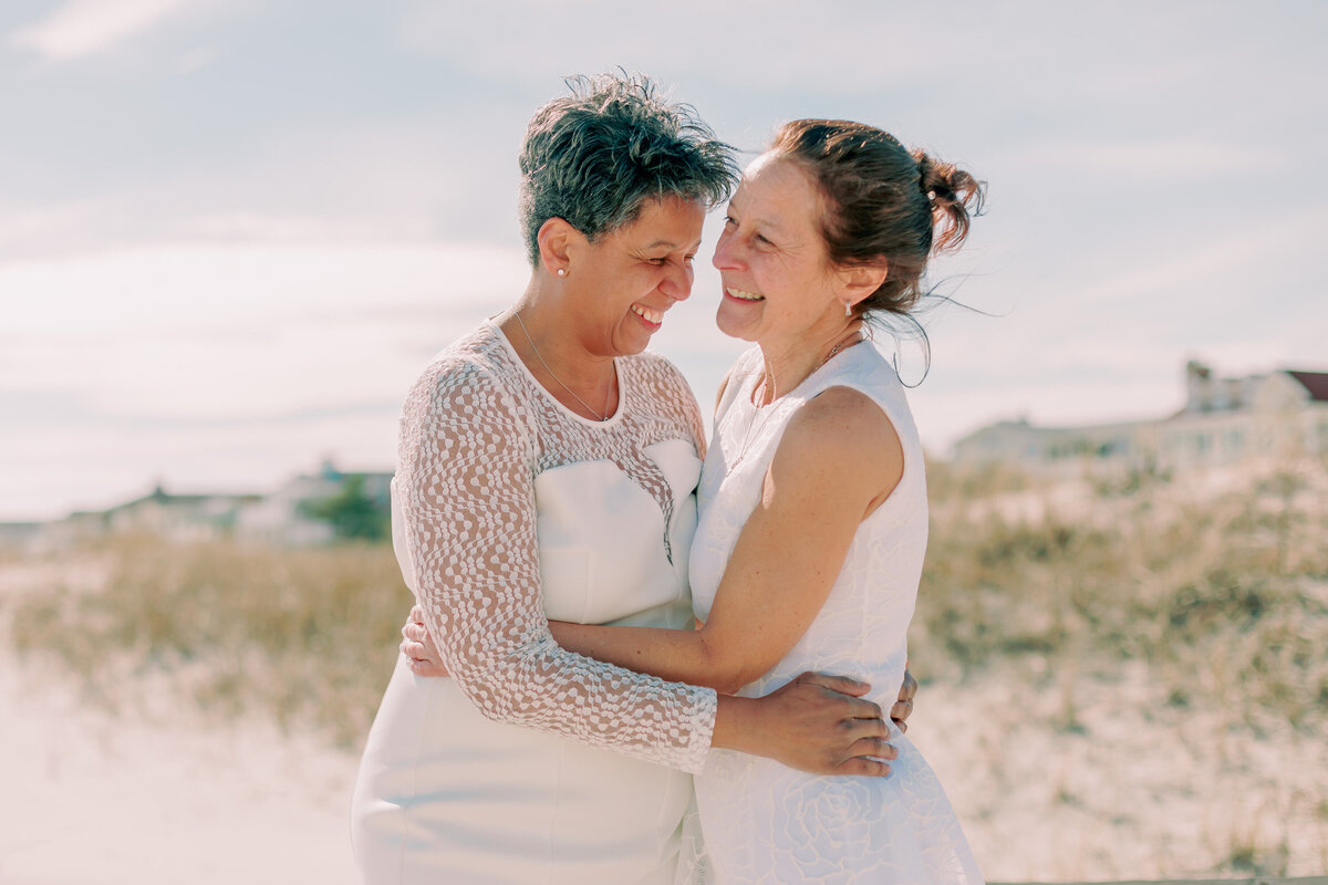 A couple holds one another on the beach in Ocean City, New Jersey.