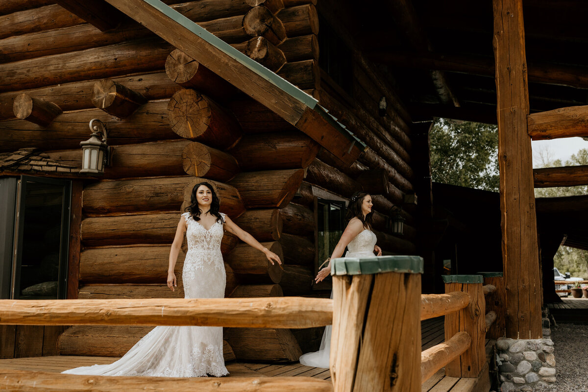 same sex couple in their wedding dresses having  a first look