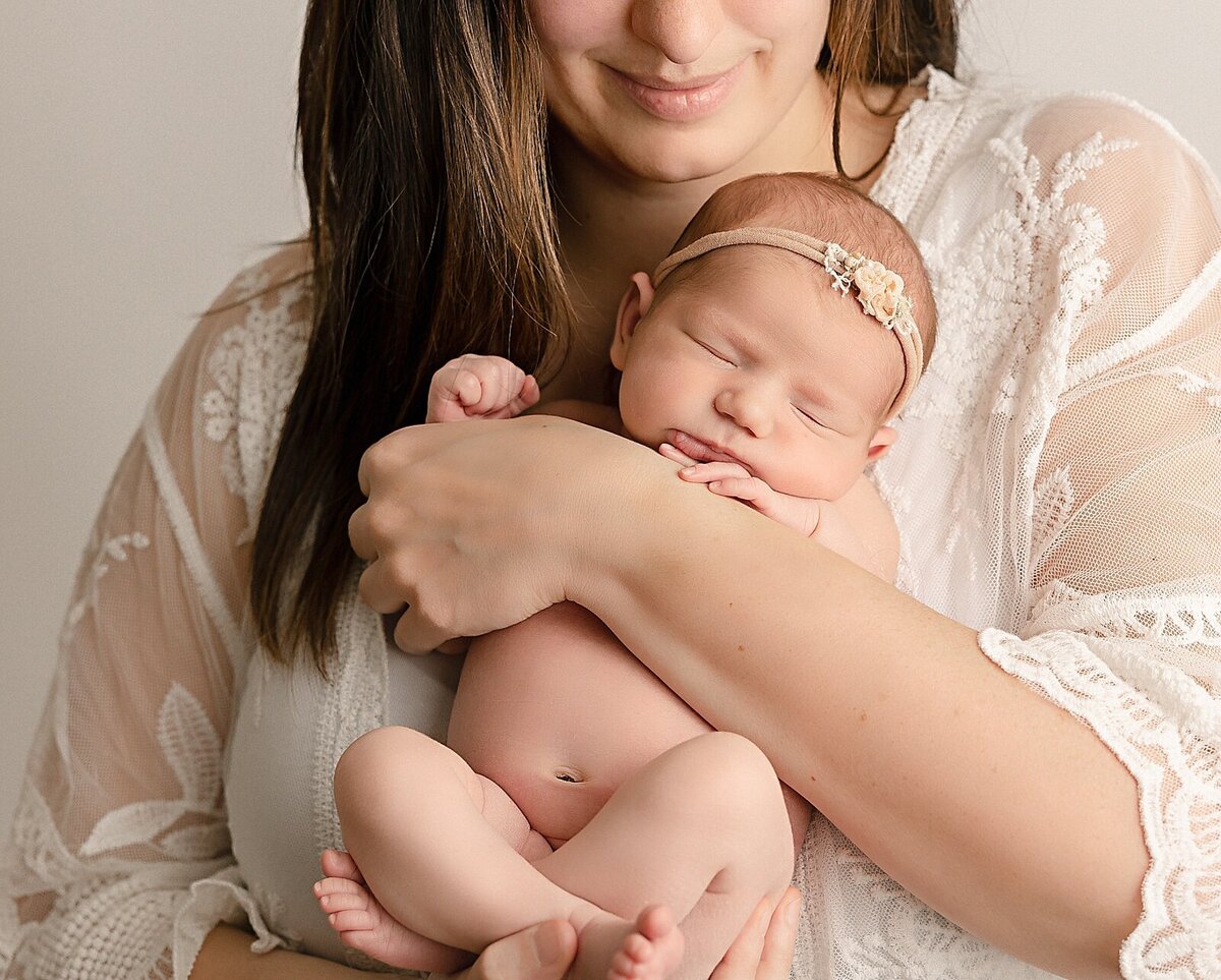 mom holding baby girl