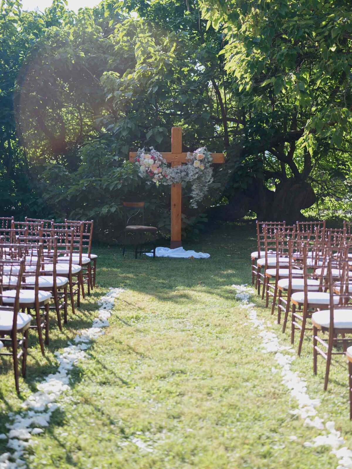 Outdoor wedding ceremony under clear blue sky.