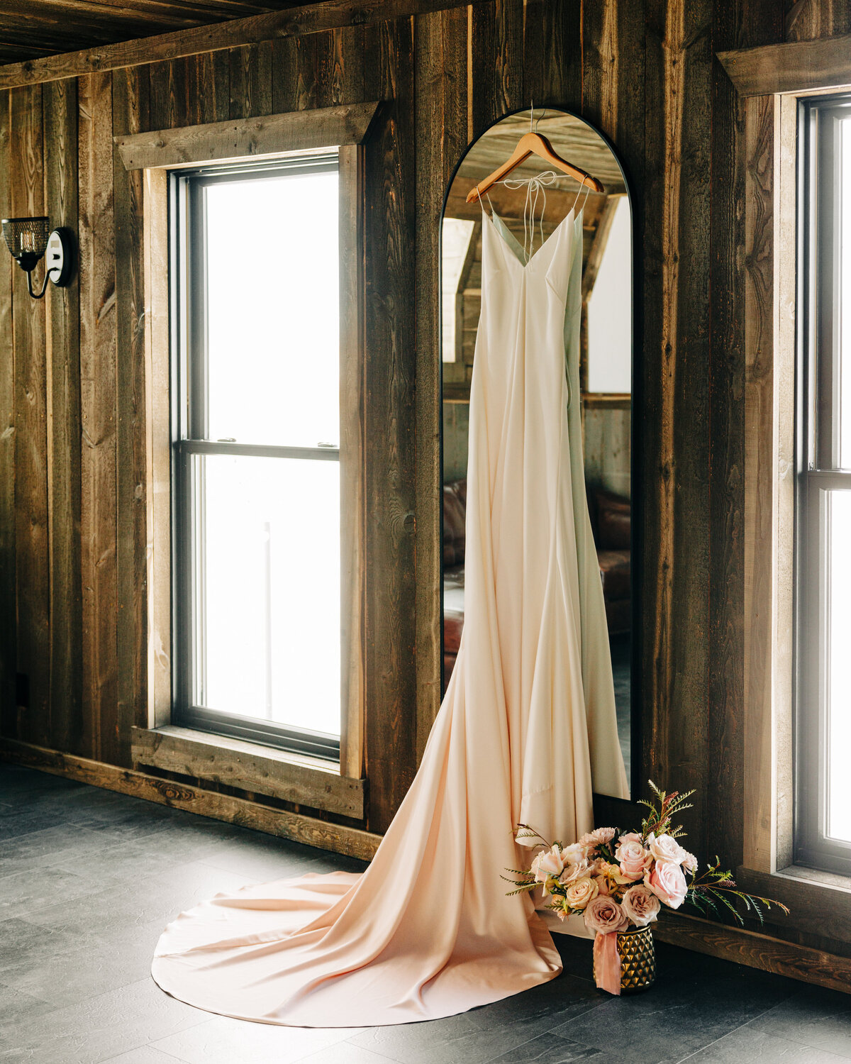 Wedding dress hanging in bridal suite at Fox Fields in Red Lodge, MT