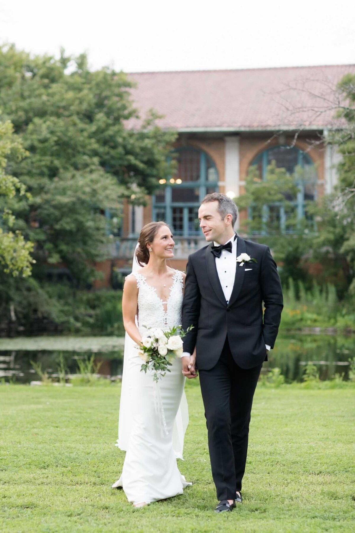 Bride and groom outside Columbus Park Refectory at their Luxury Chicago Outdoor Historic Wedding Venue.