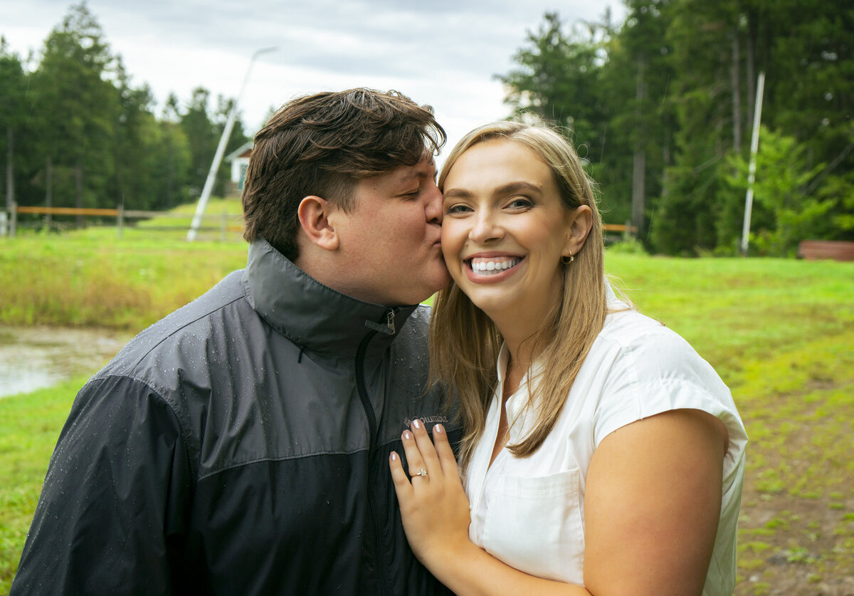 Photo of a man kissing his fiancee
