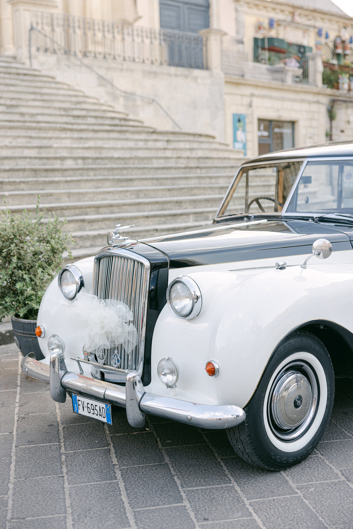 a vintage white and black car for a wedding