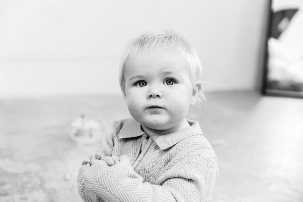Happy baby during cake smash session studio photoshoot in the London studio.