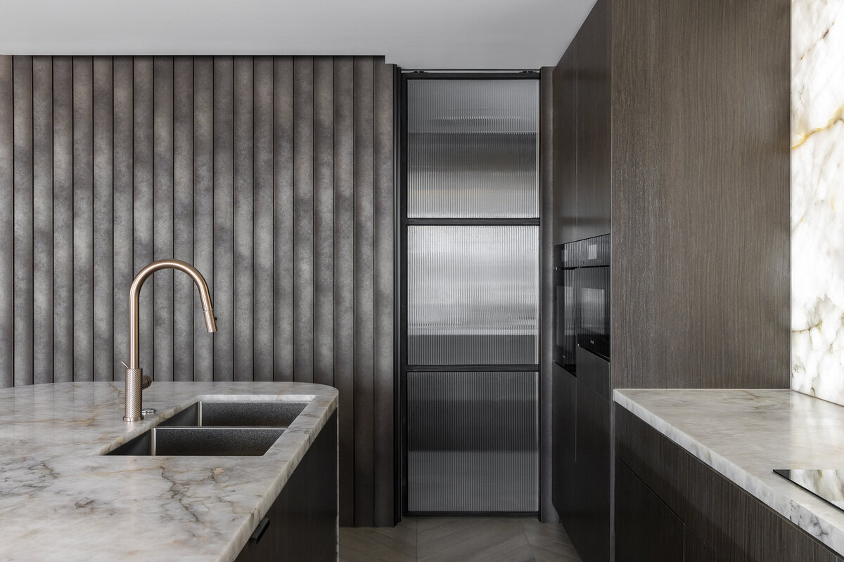 kitchen  with reeded glass door and fluted timber panelling