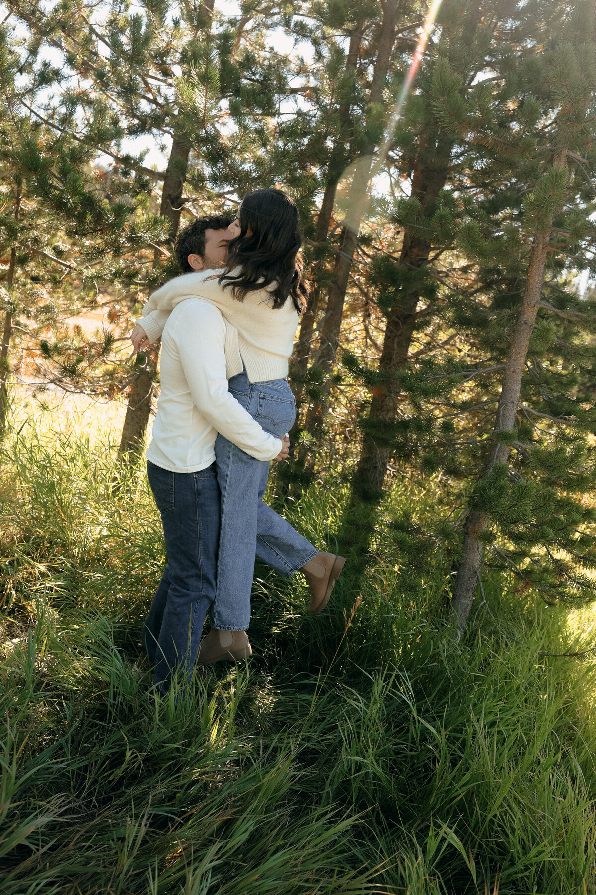 Romantic Forest Couples Session with Boyfriend Lifting Girlfriend into a Kiss