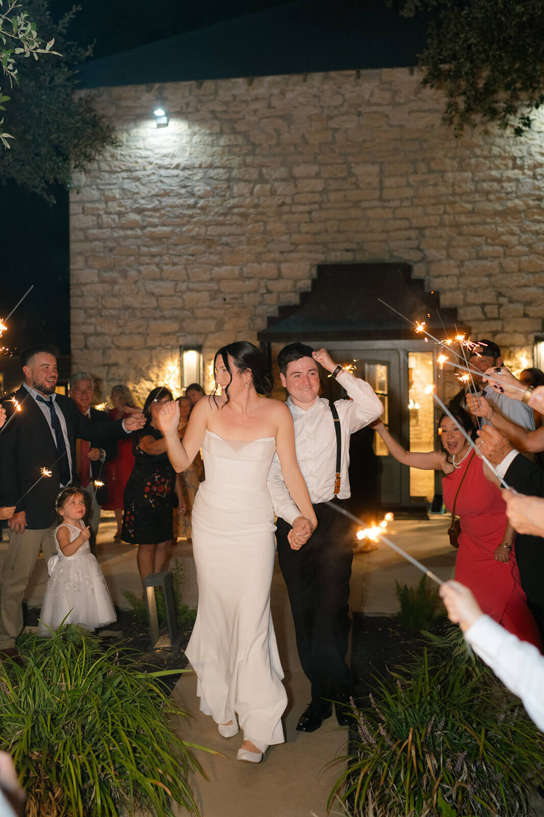 the couple exits through sparklers