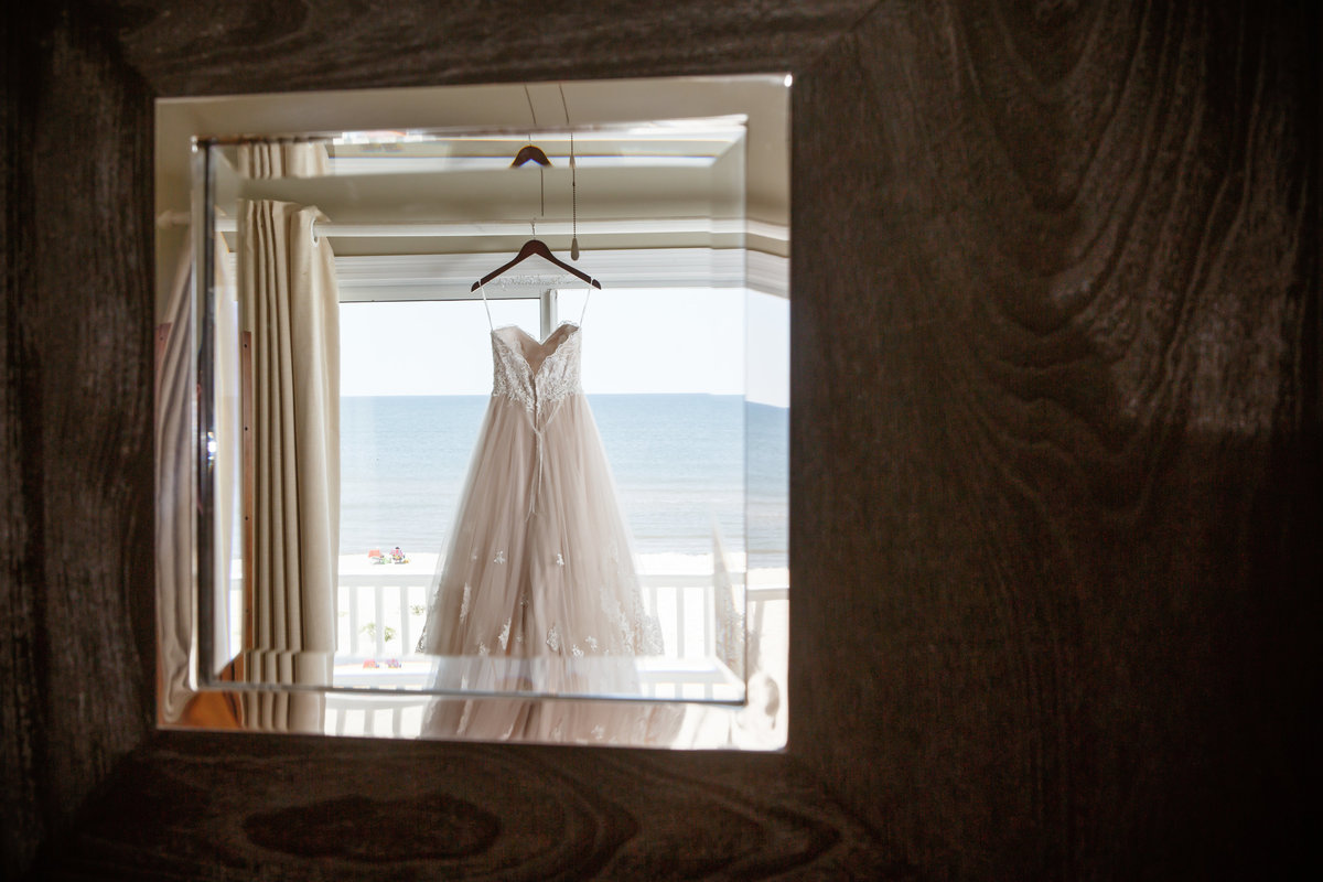Reflection photo of the bride's dress in the mirror in Fort Morgan, Alabama.