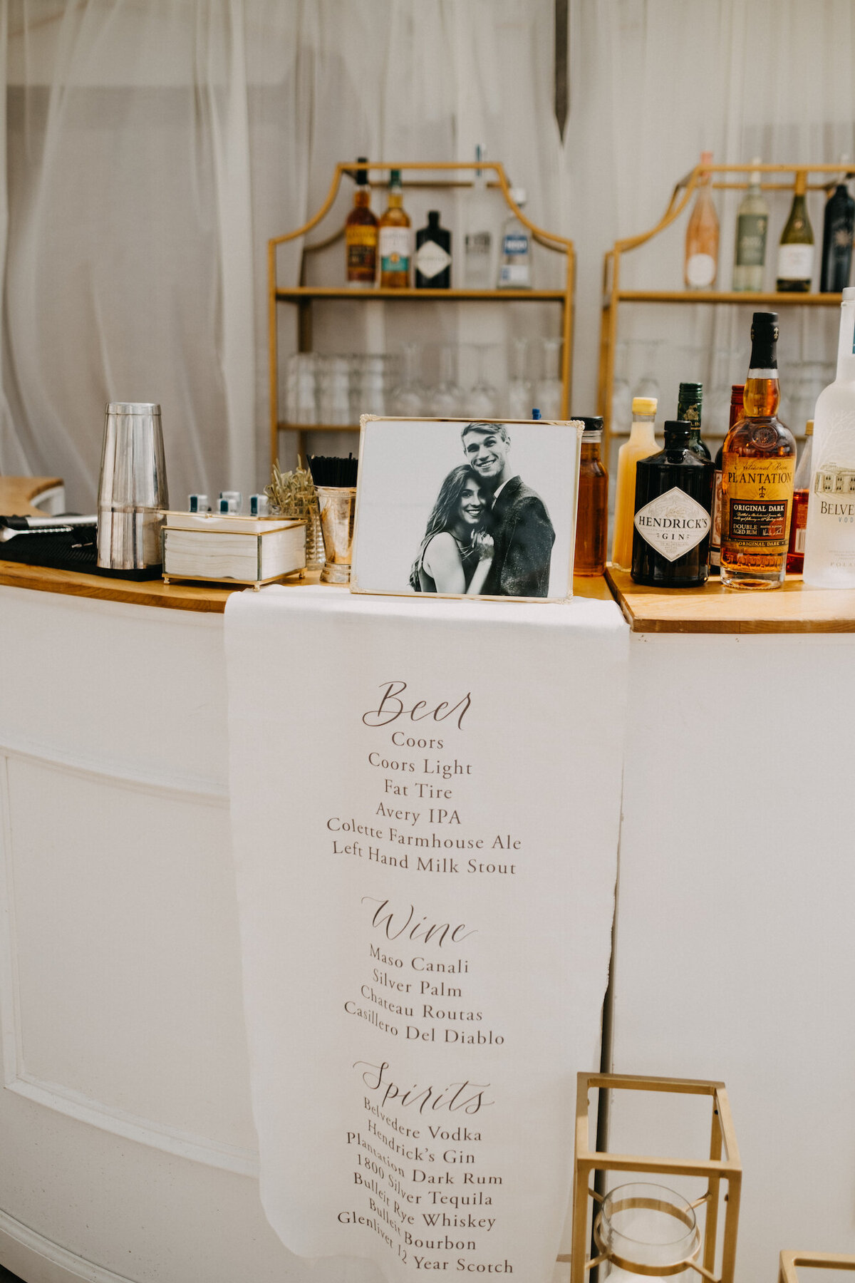 White fabric sign draped over bar