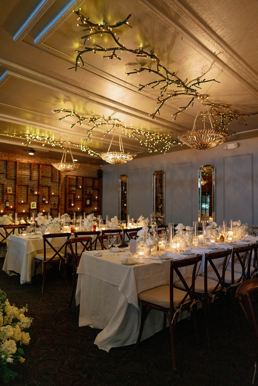 Elegant candlelit reception room at Café Cortina Michigan, Italian-inspired wedding décor.