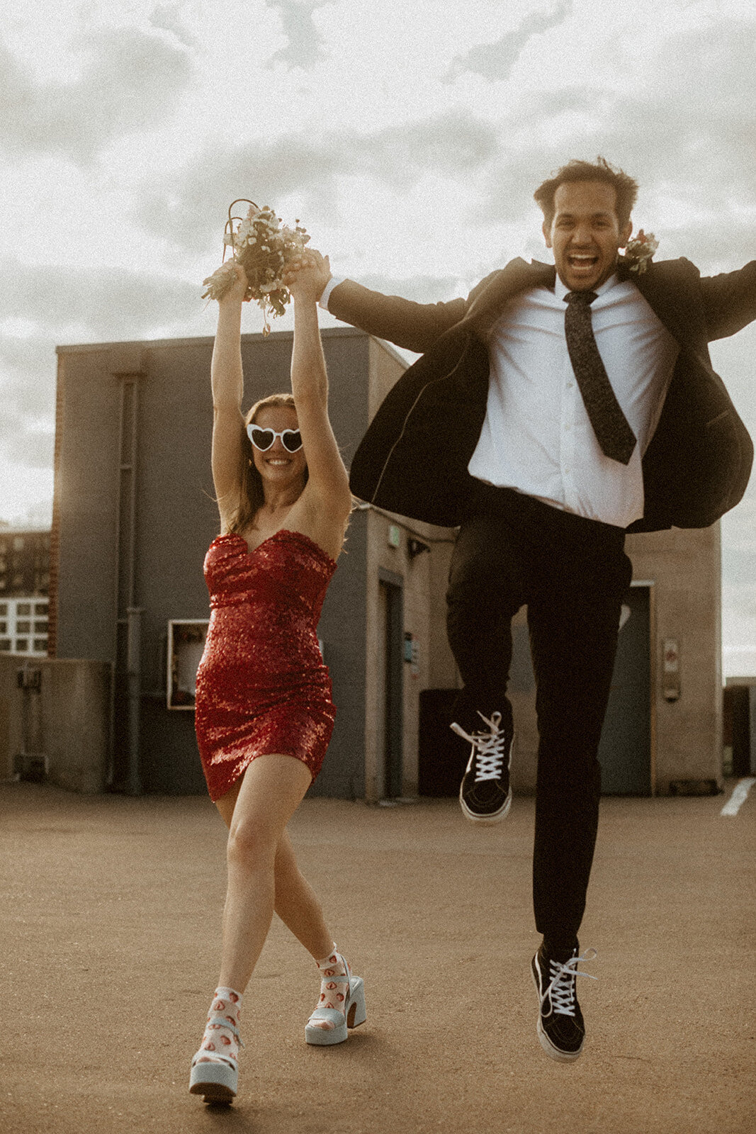 parking garage elopement with red wedding dress