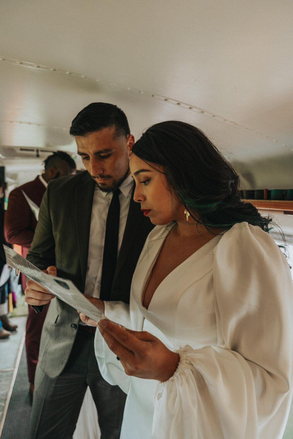 Husband points at a menu while the wife reads 