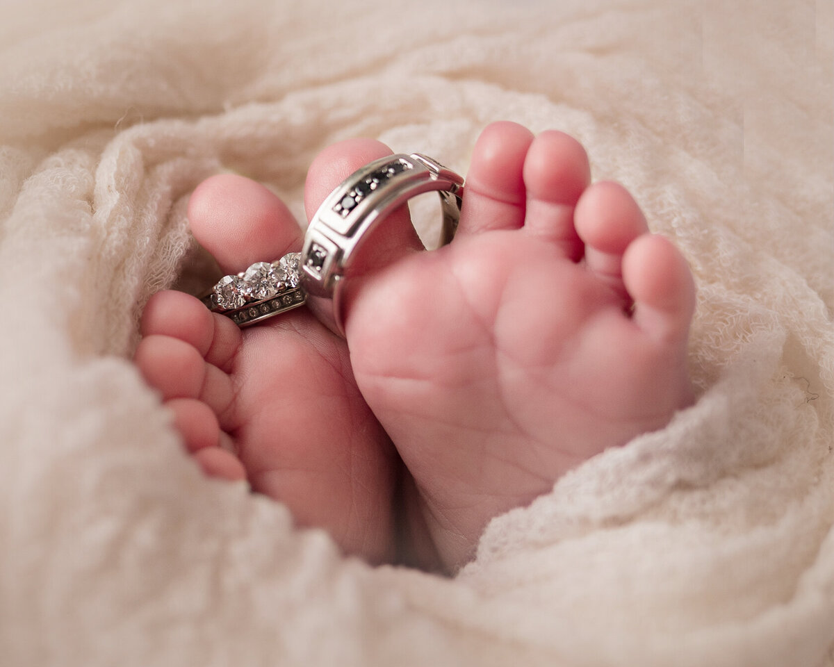 Tiny little newborn feet with ring photography