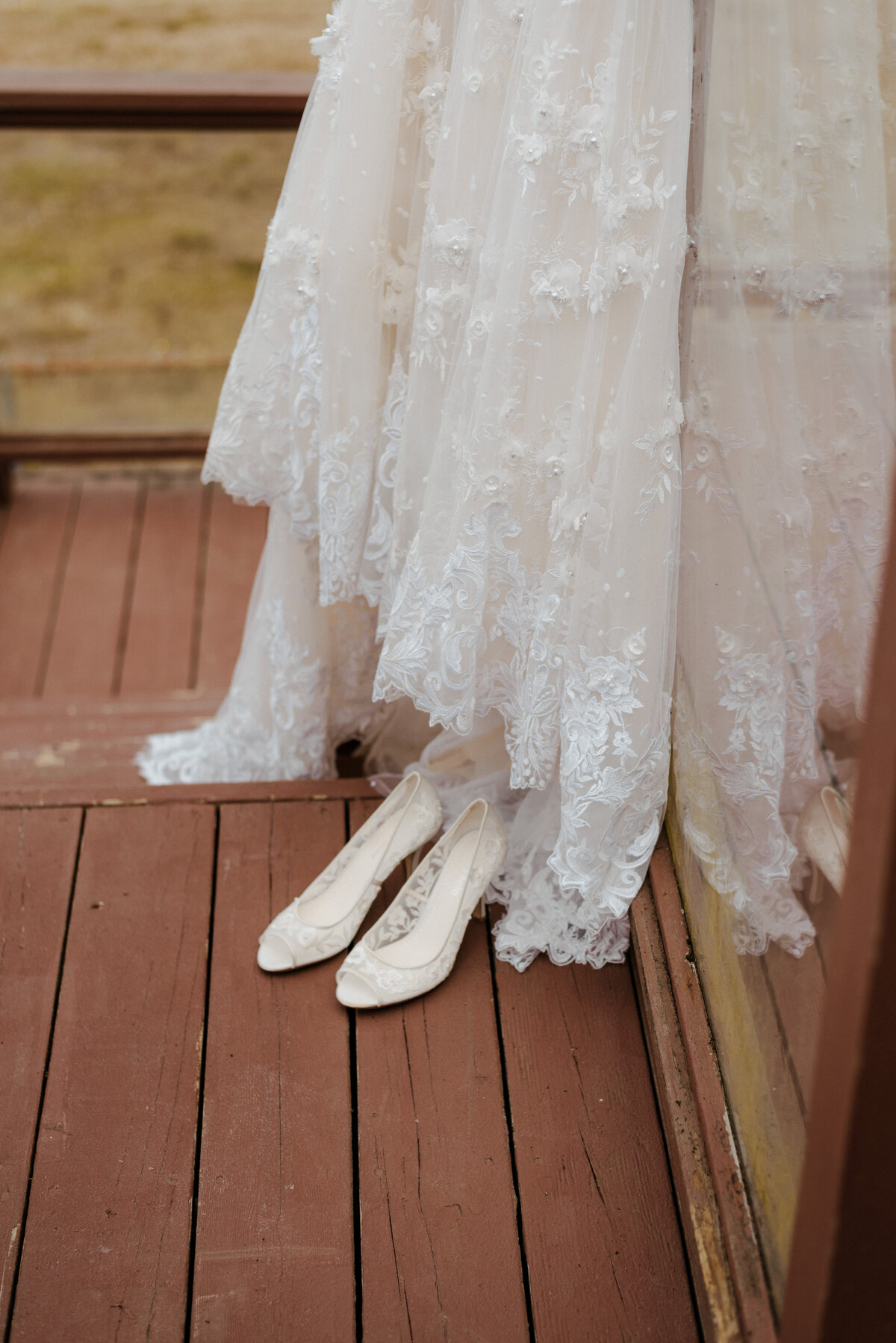 Detail shot of the dress hanging and shoes sitting under the dress.
