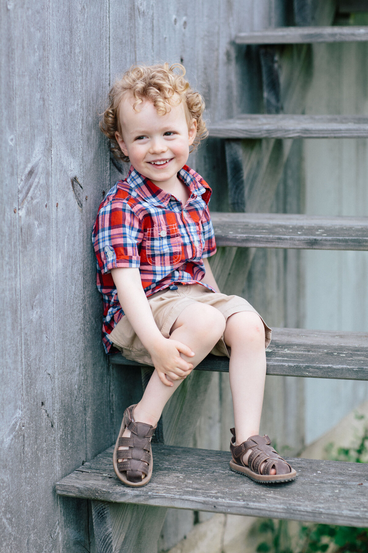 little boy in checked shirt at new hampshire family photoshoot
