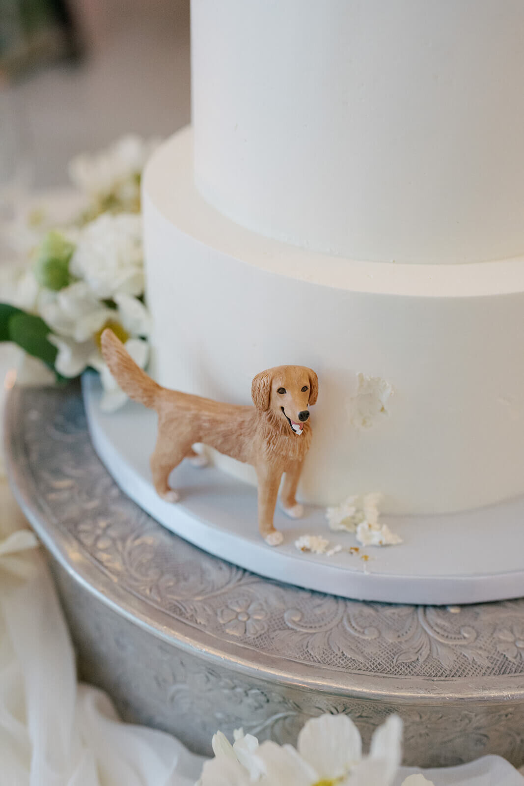 dog figurine on wedding cake