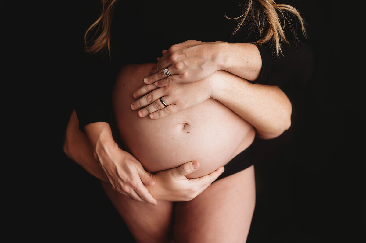 Expectant mother poses for Maternity Photos in Charleston, SC.