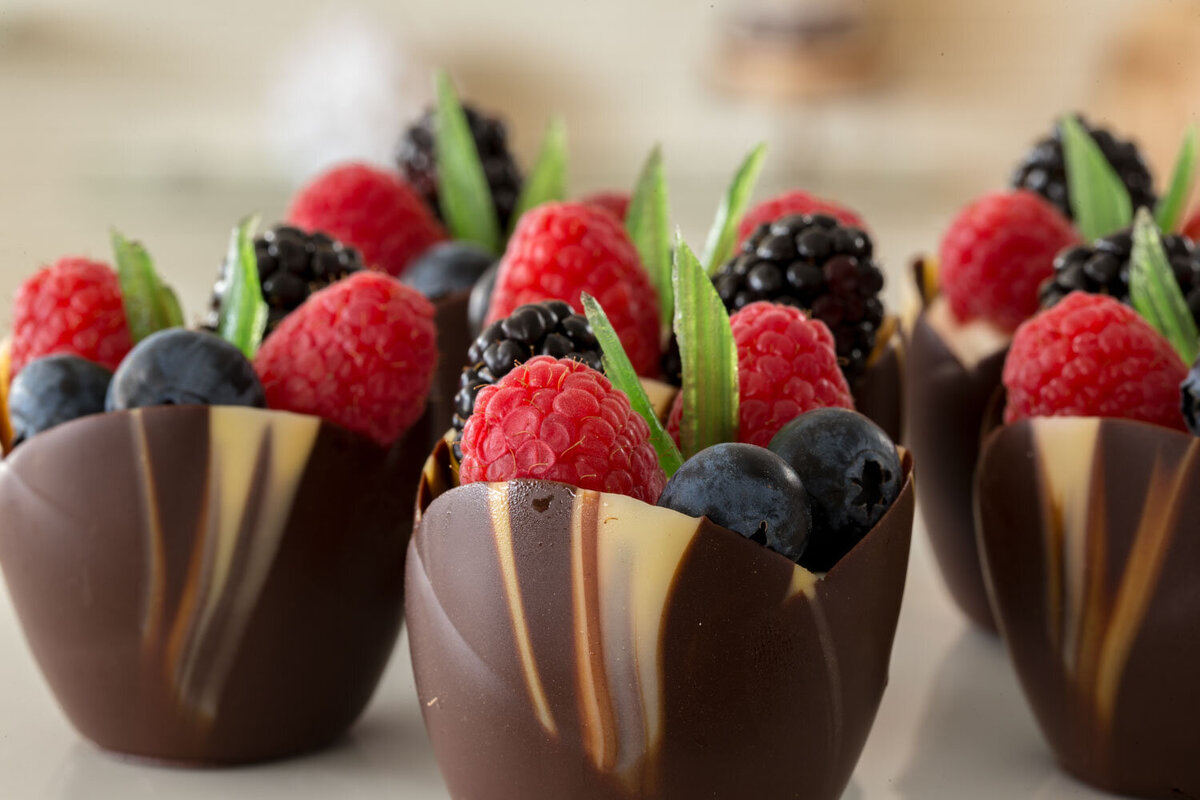 Chocolate cups filled with fresh berries