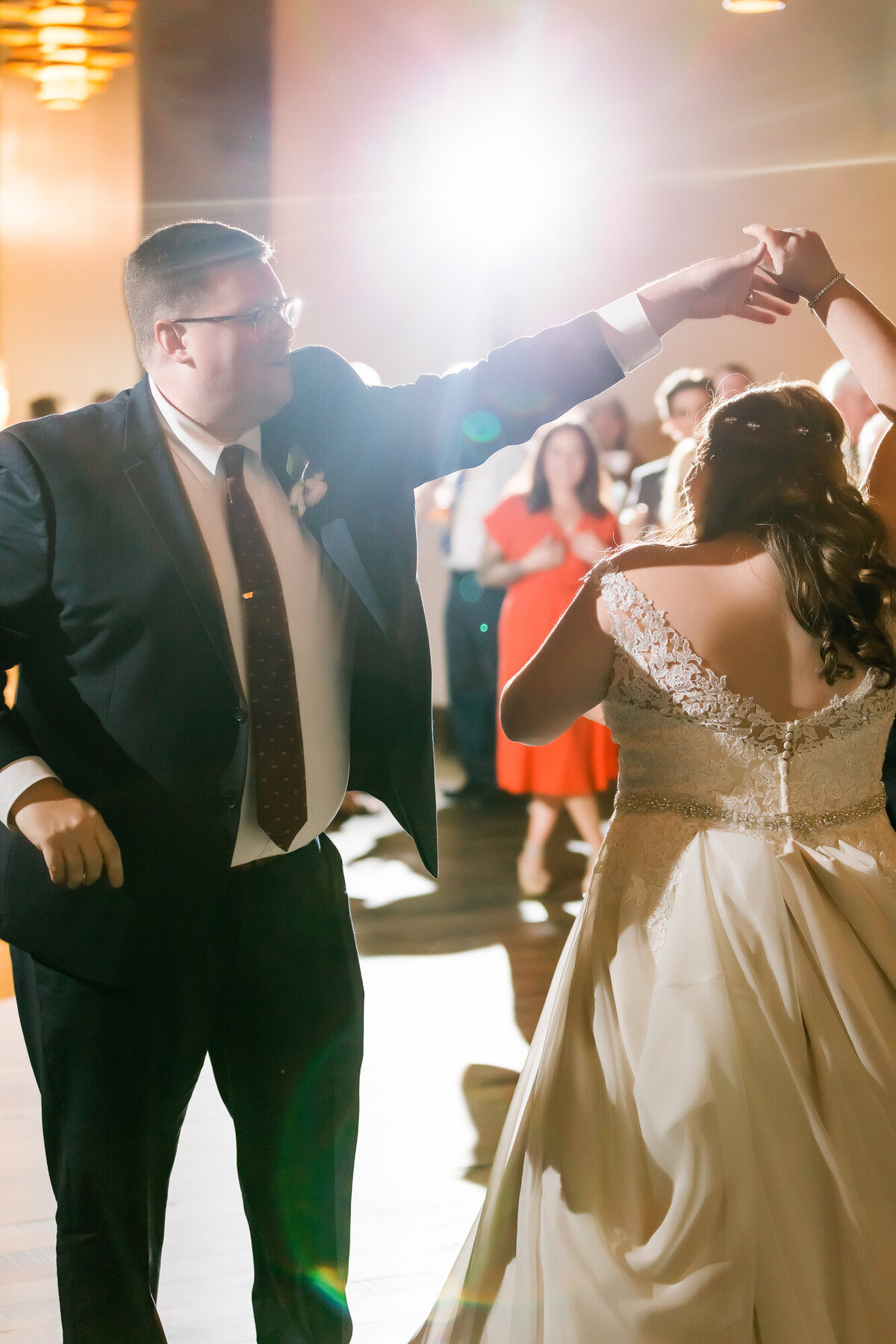 Groom spins bride during their first dance