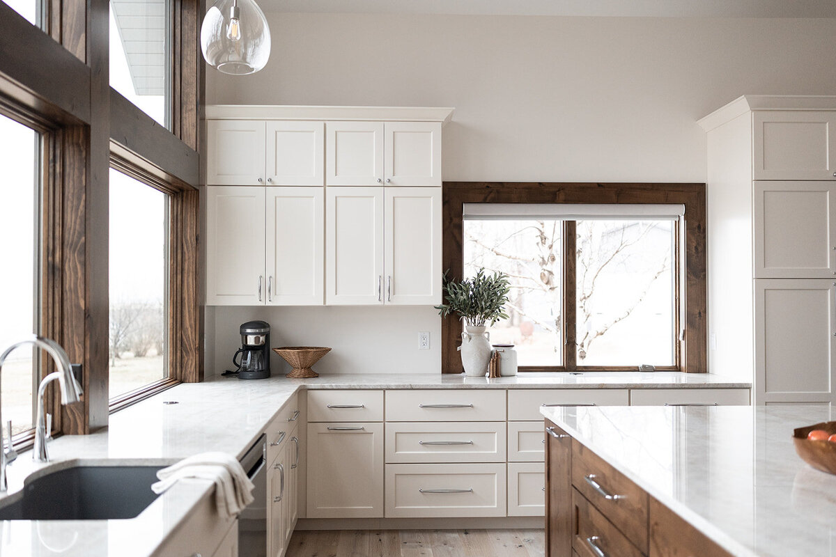 michele rosenboom design clean country renovation kitchen white cabinets and wood trimmed windows