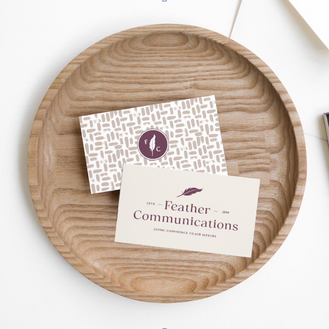 Branded business cards on wood tray for resume writer