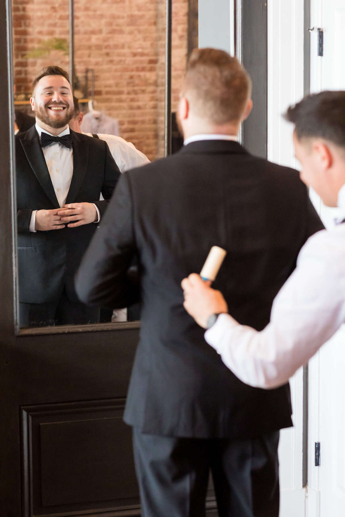 Groom getting ready in tuxedo at The Gatsby in Shelbyville,KY