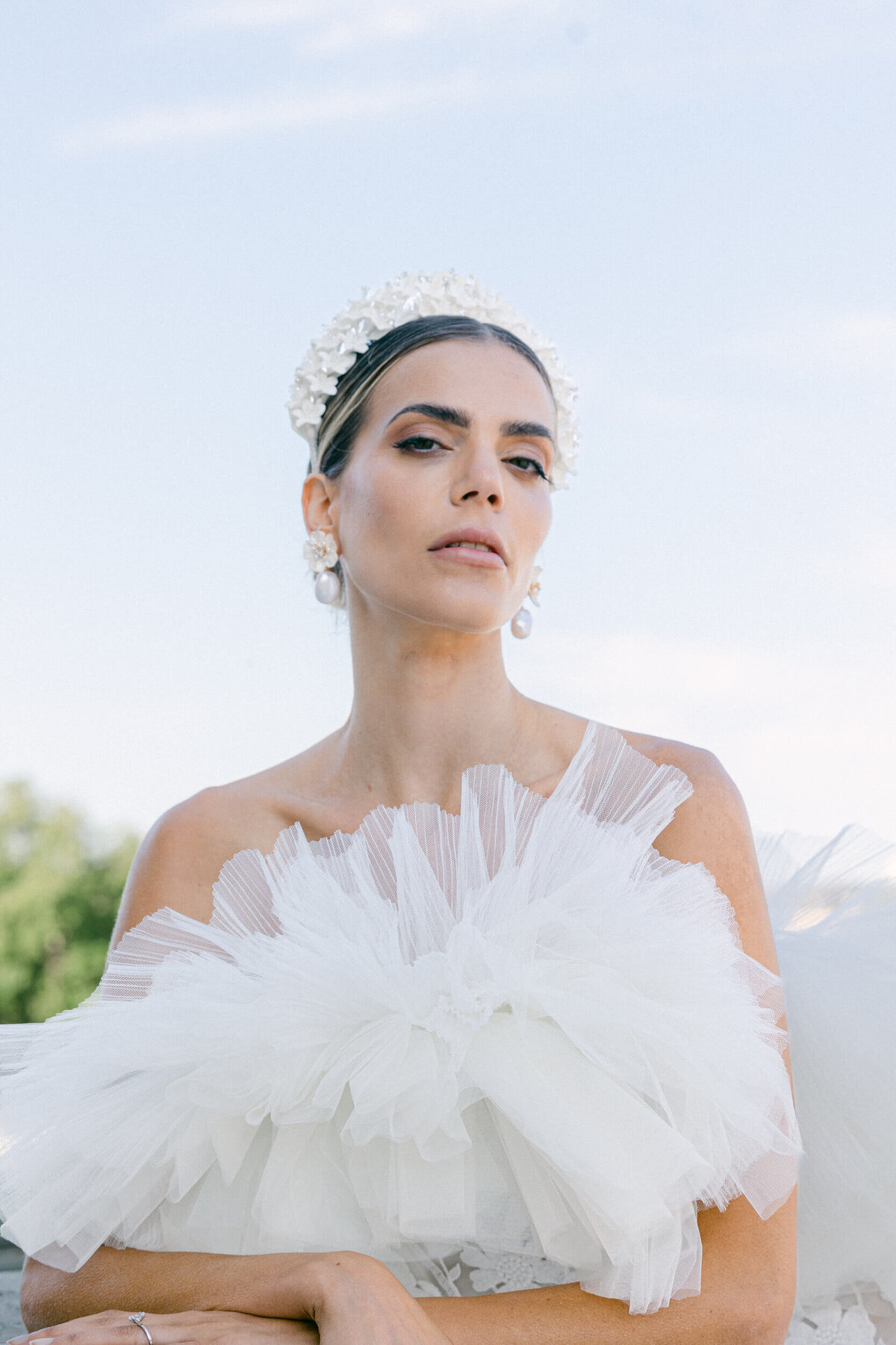 A wedding photo of a bride in her white dress in the streets of Paris in France.