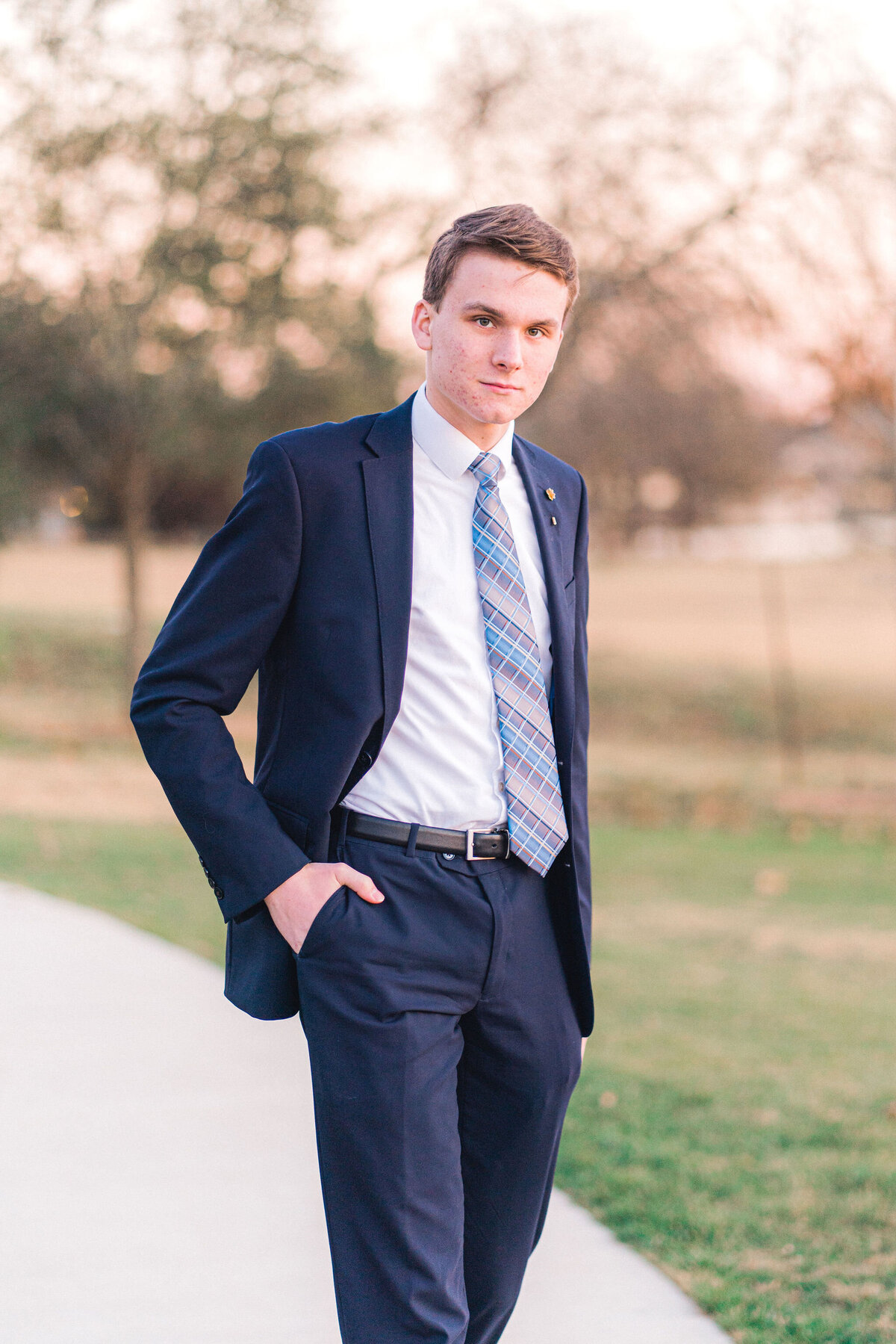 Austin senior boy in suit and tie. Outside in Austin Texas.