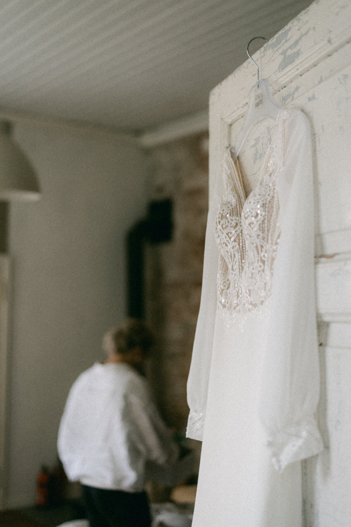 A documentary wedding  photo of a wedding dress in Oitbacka gård captured by wedding photographer Hannika Gabrielsson in Finland