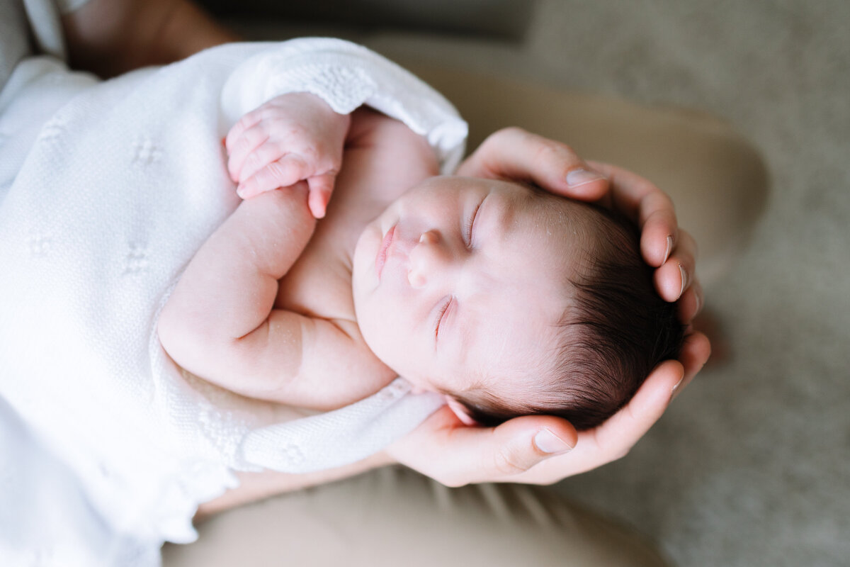 newborn-baby-boy-snuggling-during-newborn-photos