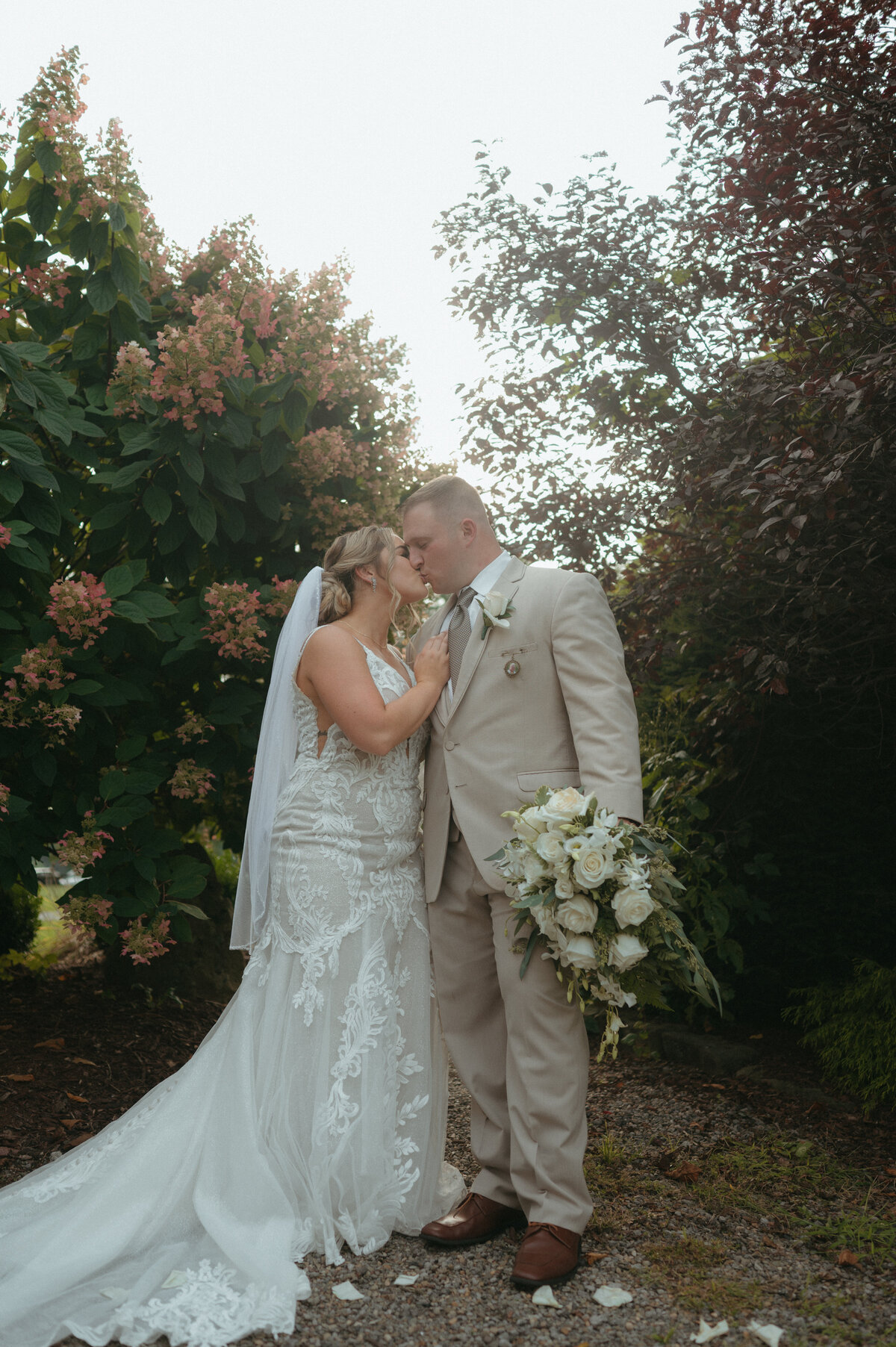 all white wedding day photos with bride and groom