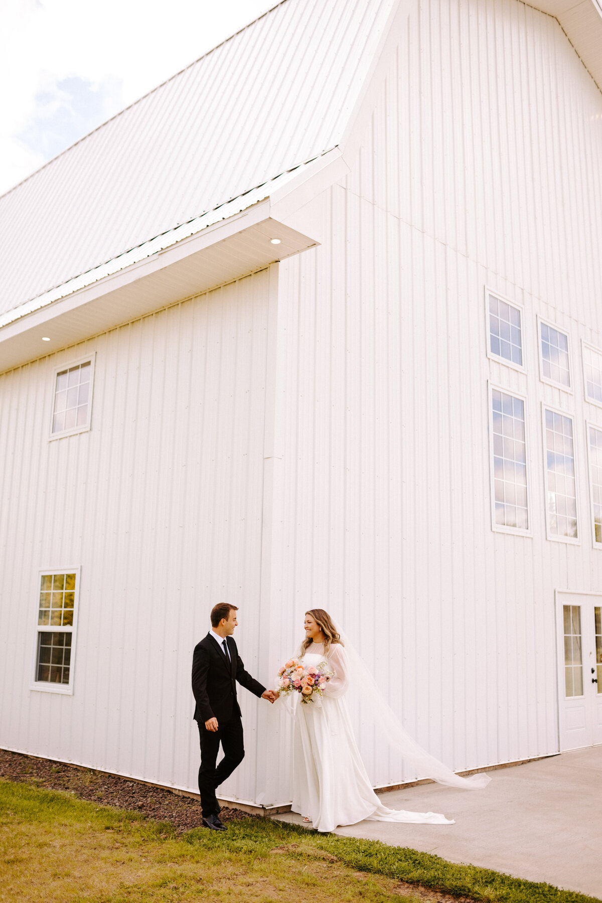Bride and Grooms first look from around the corner at a June wedding at the Grand Ivory near Moncton, New Brunswick
