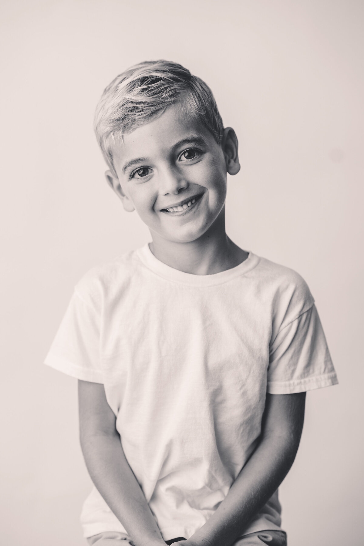 Young boy smiles at the camera during Personality Portrait Photoshoot in Charleston, SC. 