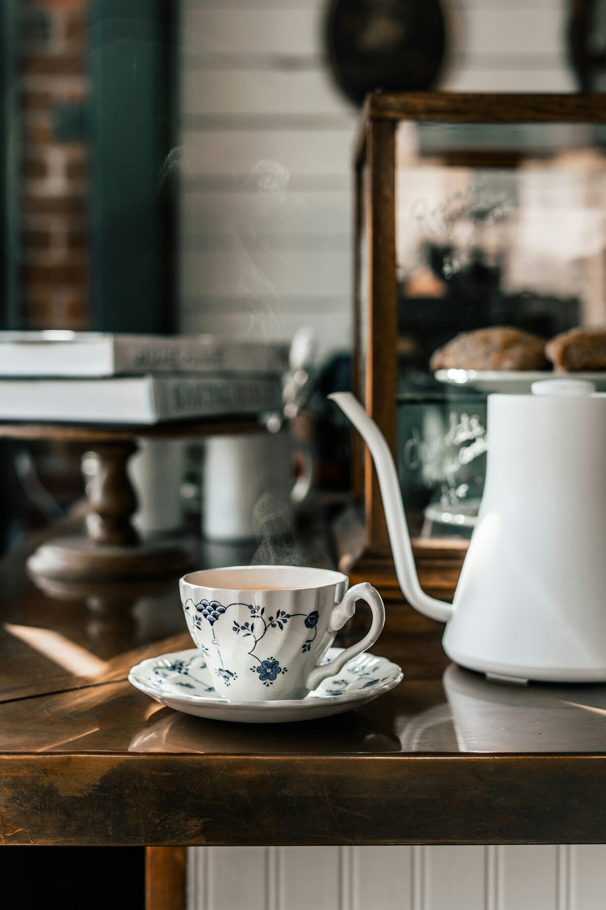 Blurred coffee shop interior background with "MORNING OAK" text centered at the top. Below, text reads: "Nestled in a small town in the Pacific Northwest..." and a button labeled "BROWSE OUR BEANS" is displayed below.