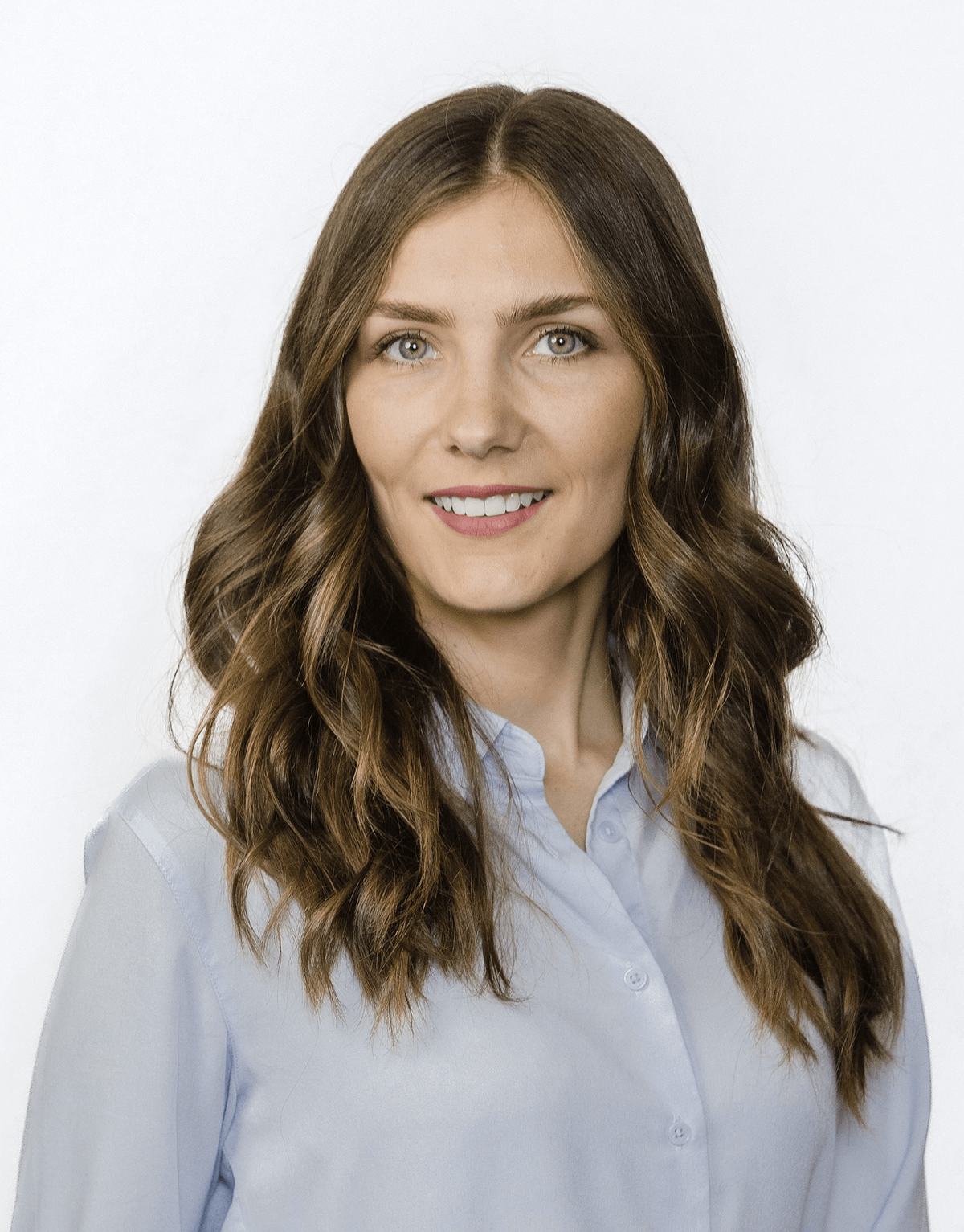 professional-headshot-young-woman-light-blue-blouse-san-diego