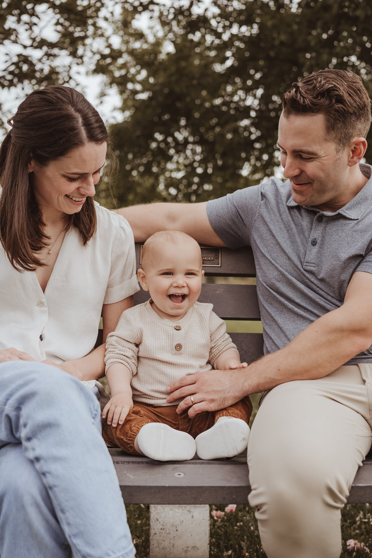 family sitting on a bench