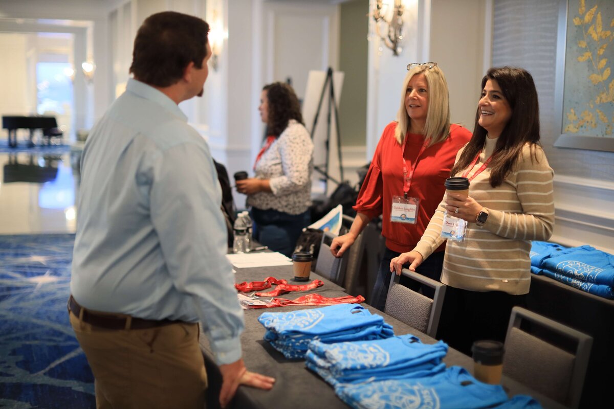 people chatting at a corporate event