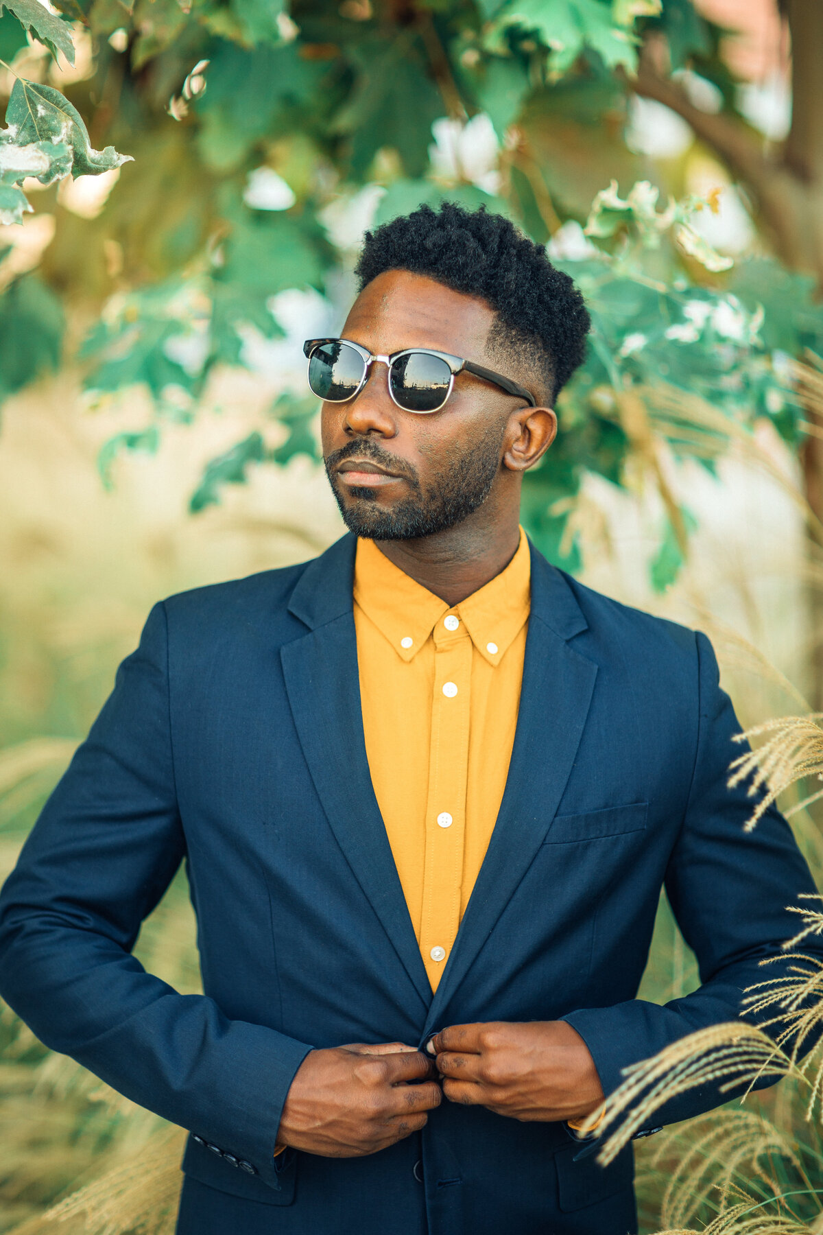 Portrait Photo Of Young Black Man Buttoning His Coat Los Angeles