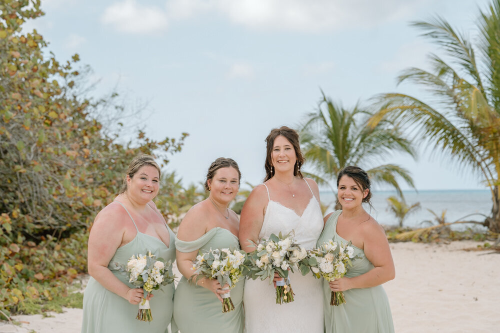 bride and bridesmaids in sage green in Cozumel