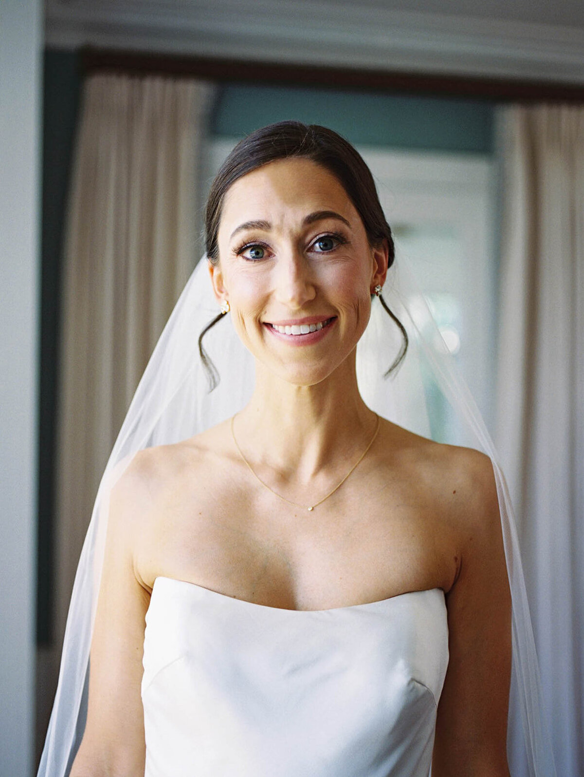 Bride looking at the camera with joy