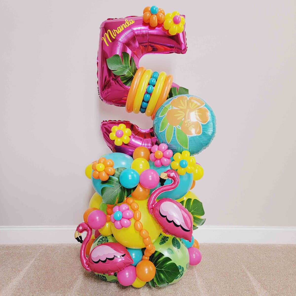 Standard Balloon Bouquet featuring whimsical Flamingos and Flowers. The event in the magic of our expertly crafted balloon artistry, creating a unique and memorable atmosphere.