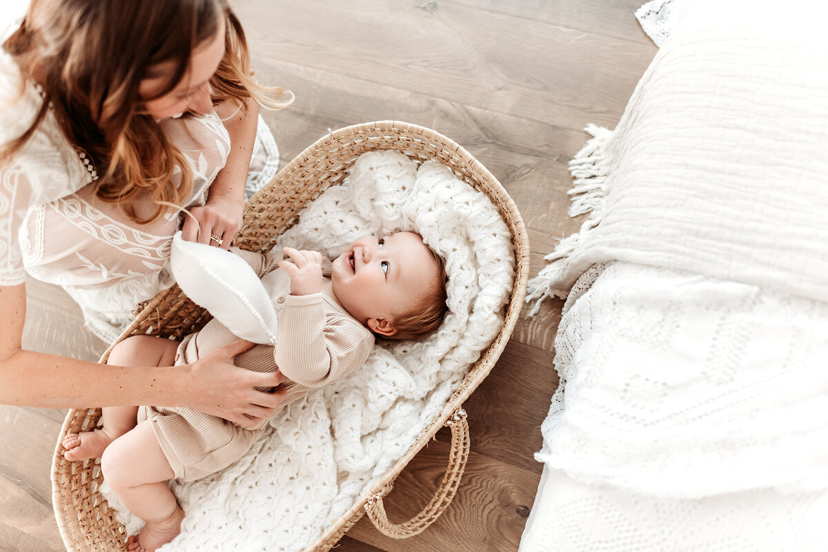 overhead view of baby boy in moses basket by Denver milestone photographer Alyssum Hutchison