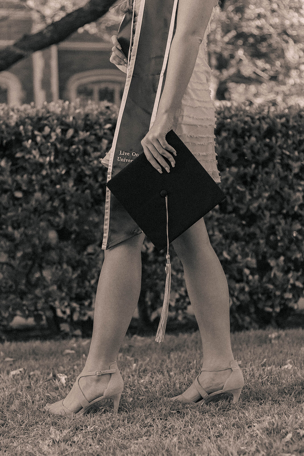 girl poses with graduation cap in dallas texas