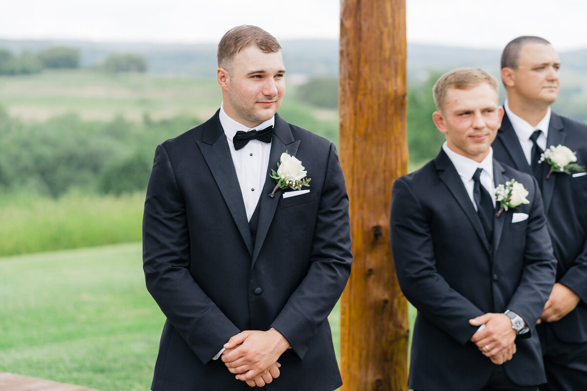 groom-waiting-ceremony-company-stables