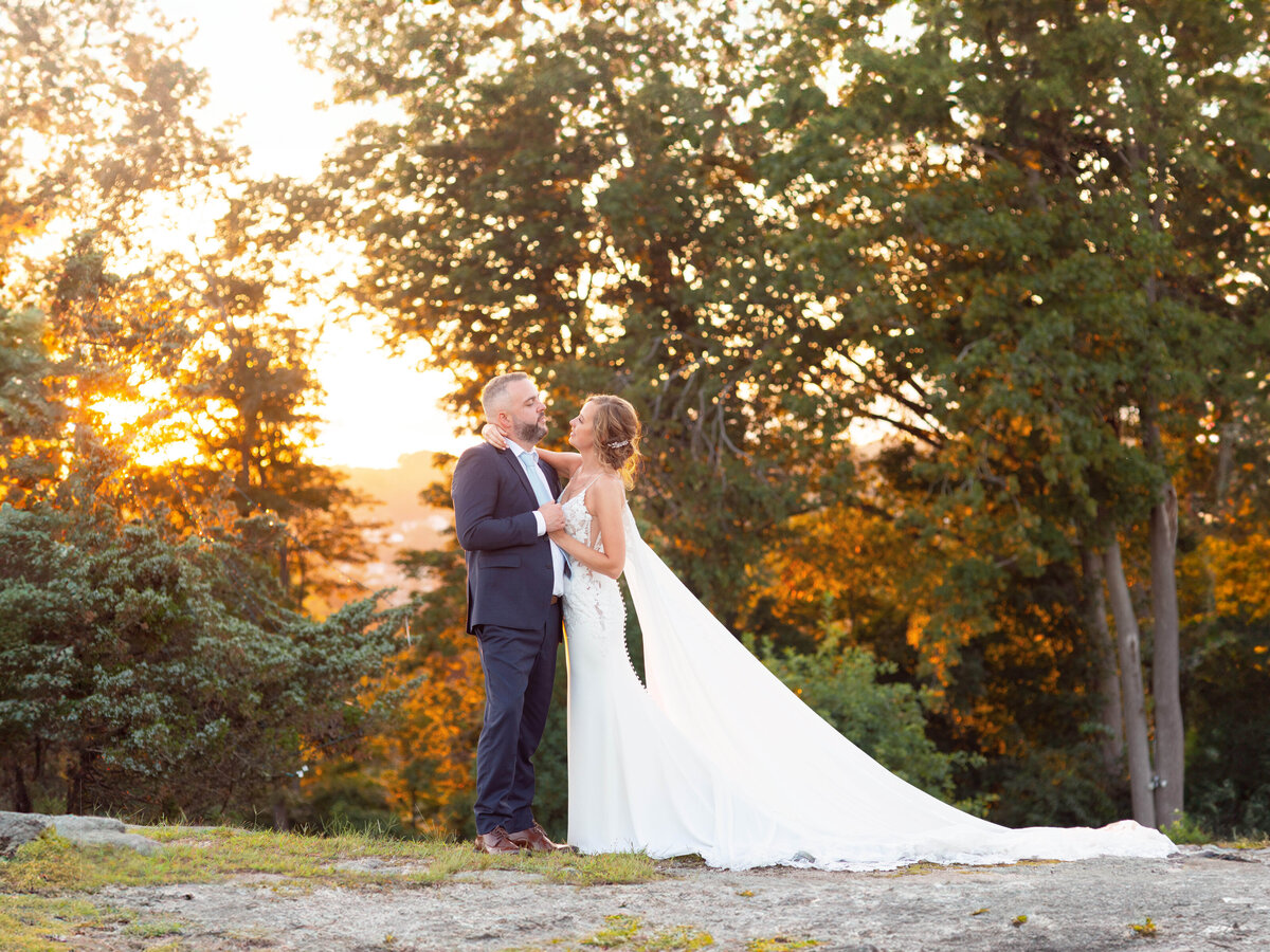 Newlyweds dance during sunset at Haley Mansion in Mystic.