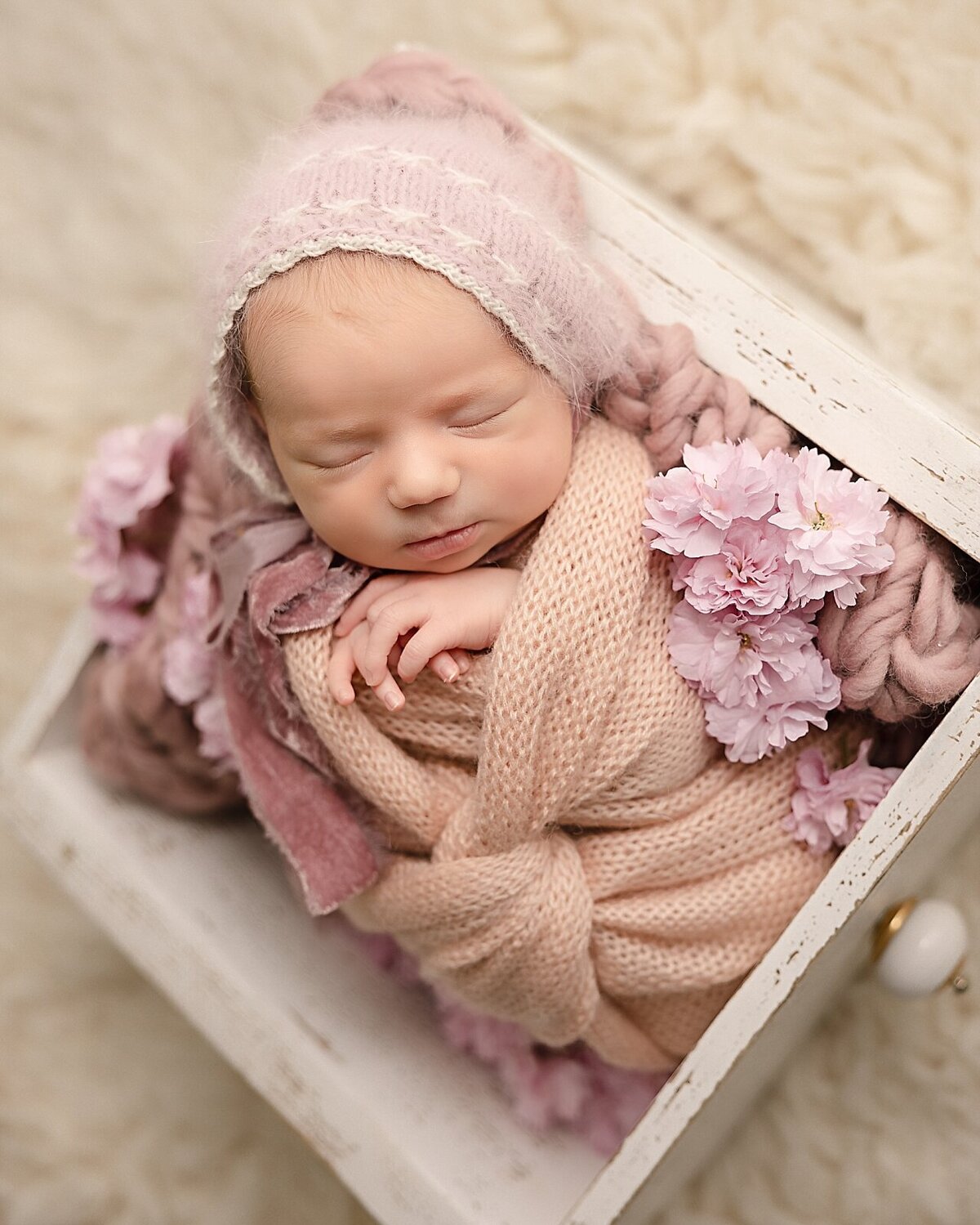 baby girl with pink flowers in baby pictures