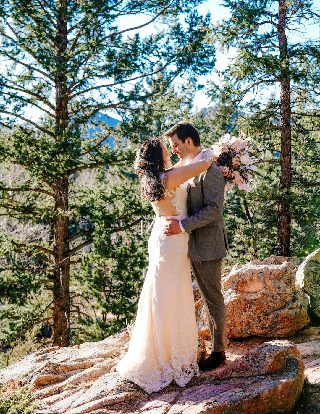 denver wedding photography - couple kissing on rock